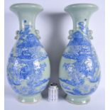 A LARGE PAIR OF 19TH CENTURY CHINESE CELADON BLUE AND WHITE VASES Late Qing, painted with figures in