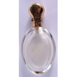 AN ANTIQUE FRENCH GOLD AND CRYSTAL GLASS SCENT BOTTLE. 8.5 cm high.