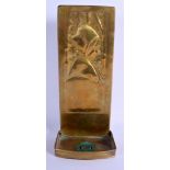 AN ARTS AND CRAFTS J CO BRASS CANDLE HOLDER WALL PLAQUE. 31 cm x 10 cm.
