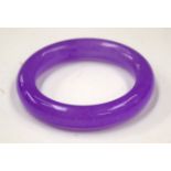 A CHINESE JADE BANGLE. 8 cm wide.