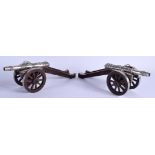 A RARE PAIR OF 19TH CENTURY CONTINENTAL SILVER TABLE CANNONS upon carved wood bases. Silver 9 oz. 27
