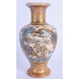 A 19TH CENTURY JAPANESE MEIJI PERIOD SATSUMA VASE painted with figures within landscapes. 16.5 cm hi