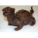 A CHINESE BRONZE INCENSE BURNER AND COVER. 12 cm wide.