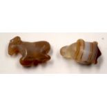 TWO CENTRAL ASIAN STONE AMULETS. (2)