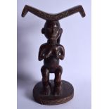 AN AFRICAN TRIBAL CARVED WOOD DOUBLE FIGURAL HEAD REST formed as nude females. 30 cm x 16 cm.