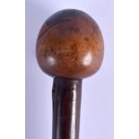 AN AFRICAN TRIBAL CARVED LIGNUM VITAE KNOBKERRIE THROWING CLUB. 77 cm long.