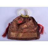 A 19TH CENTURY CHINESE SILKWORK PURSE Qing, with double jade twist handle. Purse 15 cm x 15 cm.