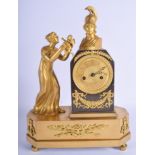 AN EARLY 19TH CENTURY FRENCH EMPIRE ORMOLU MANTEL CLOCK modelled as a female viewing a classical bus