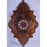 A RARE LARGE 19TH CENTURY BLACK FOREST CARVED WALL CLOCK with matching wall plaques, formed as a bir