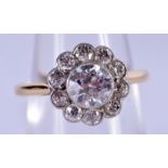 A FINE ANTIQUE GOLD AND DIAMOND CLUSTER RING with attached diamonds to the outside. 3.1 grams. Centr