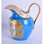 A LATE 19TH CENTURY FRENCH POWDER BLUE CREAM JUG painted with putti and clouds.14 cm x 12 cm.