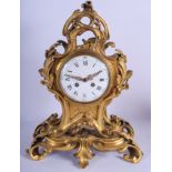 A LARGE EARLY 19TH CENTURY FRENCH ORMOLU MANTEL CLOCK of scrolling foliate form. 44 cm x 27 cm.