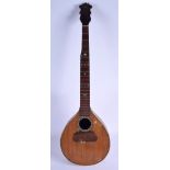 AN EARLY 20TH CENTURY GAMBUSI NDOGO MANDOLIN with wood inlay to the exterior rim. 83 cm long.