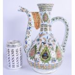 A RARE TURKISH FAIENCE KUTAHYA POTTERY EWER painted with floral sprays in the Islamic style. 28 cm x