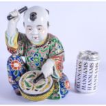 A 19TH CENTURY JAPANESE MEIJI PERIOD AO KUTAI PORCELAIN DRUMMER modelled as a young boy. 26 cm x 15