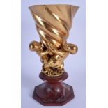 A RARE LATE 18TH/19TH CENTURY FRENCH ORMOLU FIGURAL VASE formed as three putti holding aloft a shell