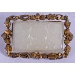 AN EARLY 20TH CENTURY CHINESE CARVED JADE PLAQUE Late Qing, within a silver gilt frame. Jade 3.25 cm