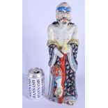 AN EARLY 20TH CENTURY CHINESE FAMILLE NOIRE PORCELAIN FIGURE modelled as a male holding a gourd. 36