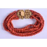 A CONTINENTAL 18CT GOLD AND CORAL NECKLACE. 322 grams. Each strand 40 cm long, largest bead 0.6 cm x