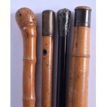 FOUR ASSORTED VINTAGE WALKING CANES including a gnurled bamboo cane. Largest 90 cm long. (4)