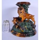 A 19TH CENTURY BOHEMIAN EICHWALD BERNHARD BLOCH MAJOLICA CENTREPIECE formed with lions amongst folia