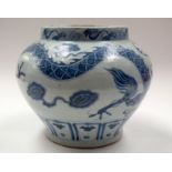 A LARGE CHINESE BLUE AND WHITE GUAN DRAGON JAR. 29 cm x 24 cm.