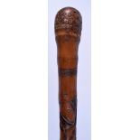 AN UNUSUAL 19TH CENTURY CONTINENTAL FOLK ART WALKING CANE decorated with star and flower motifs. 84