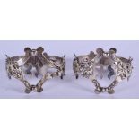 A RARE PAIR OF 19TH CENTURY CHINESE SILVER NAPKIN HOLDERS. 80 grams. 5.5 cm x 4 cm.