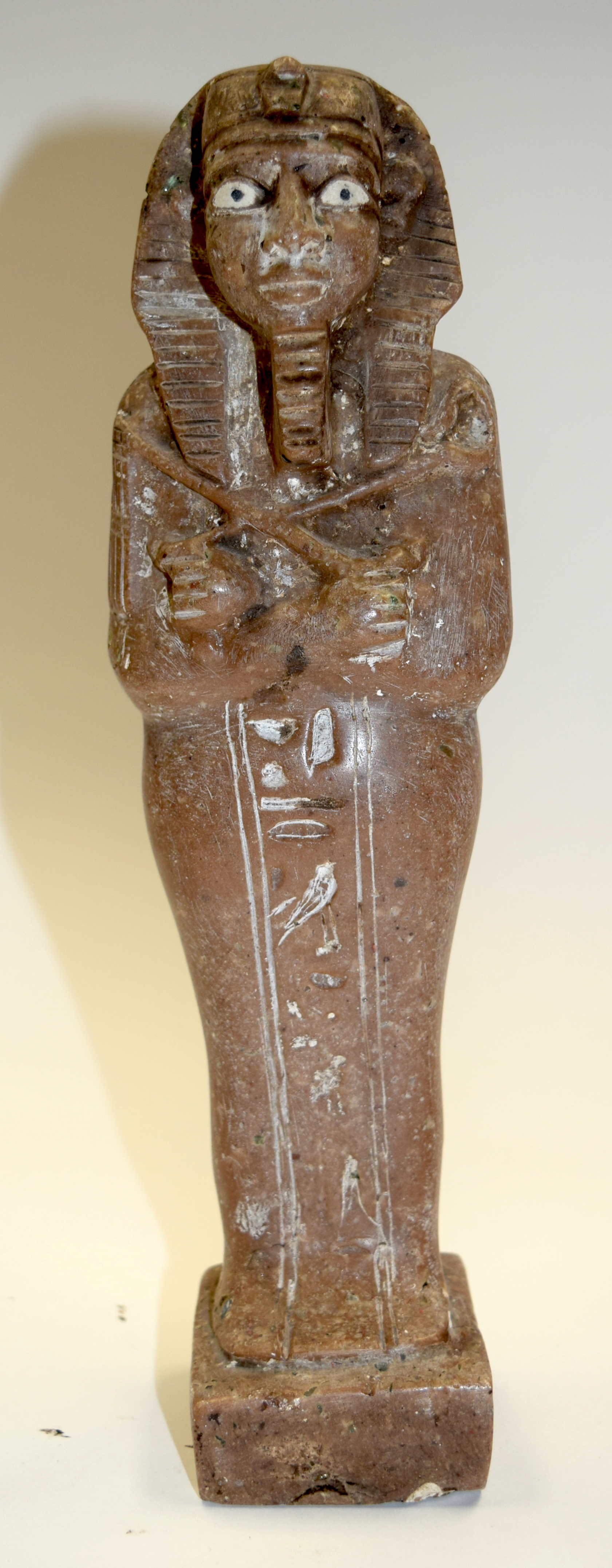AN ANTIQUE EGYPTIAN STONE FIGURE. 30 cm high.