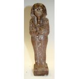 AN ANTIQUE EGYPTIAN STONE FIGURE. 30 cm high.