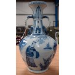 A CHINESE TWIN HANDLED YUAN STYLE VASE. 34 cm high.