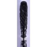 A RARE 19TH CENTURY CONTINENTAL CARVED BLACKWOOD WALKING CANE with presentation inscription to body.