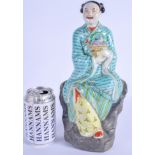 A 1960S CHINESE FAMILLE ROSE PORCELAIN FIGURE OF A MALE modelled holding a basket of flowers. 30 cm