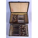A RARE CASED SET OF 19TH CENTURY BAVARIAN BLACK FOREST KNIVES inset with ivory hunting sce