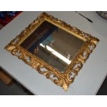 AN ANTIQUE FLORENTINE MIRROR. 42 cm x 37 cm.