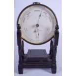 AN ANTIQUE NEWTO & CO BAROMETER upon an ebonised base. 14 cm x 24 cm.