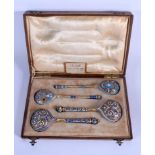 A CASED COLLECTION OF FOUR RUSSIAN SILVER ENAMEL SPOONS colourfully decorated with flowers, birds an