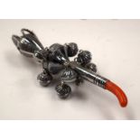 A SILVER RATTLE. 12.5 cm long.