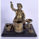 A 19TH CENTURY CONTINENTAL BRONZE FIGURE OF A SEATED DANDY modelled beside a barrel. 15 cm x 15 cm.