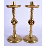 A PAIR OF 19TH CENTURY CONTINENTAL ECCLESIASTICAL BRASS CANDLESTICKS. 24 cm high.