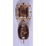 A VINTAGE GOLD AND TOPAZ FANCY BROOCH together with a gold mourning brooch. 11.6 grams. (2)