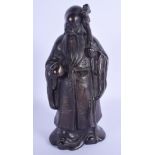 A 19TH CENTURY CHINESE BRONZE FIGURE OF AN IMMORTAL Qing, modelled holding a peach. 25 cm x 10 cm.