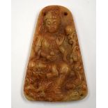 A CHINESE MUTTON JADE PENDANT, carved with seated Guanyin. 6.5 cm x 4.25 cm.
