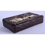 A 19TH CENTURY BAVARIAN BLACK FOREST CARVED IVORY AND ANTLER HORN SNUFF BOX decorated with hunting s