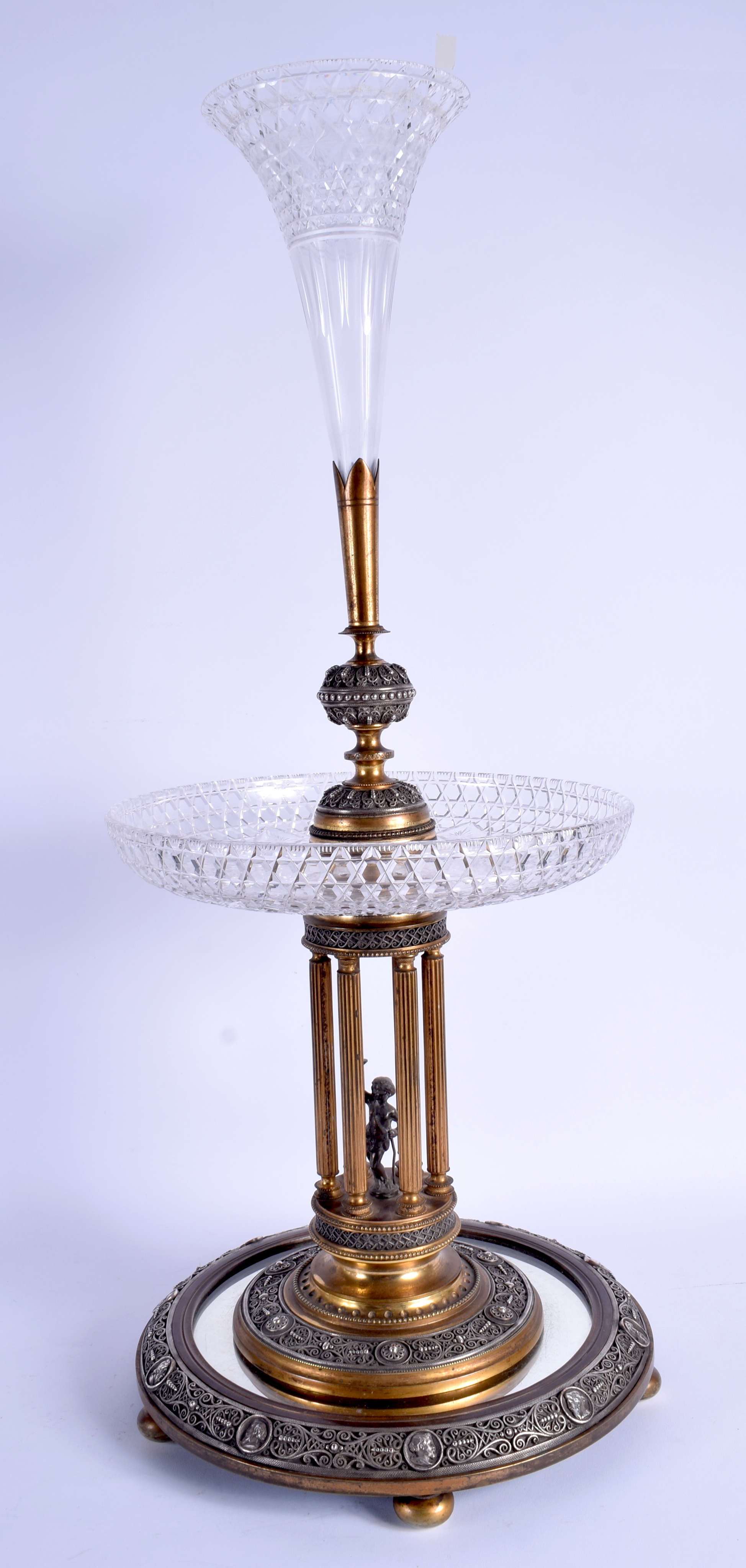A LARGE 19TH CENTURY ENGLISH SILVER PLATED BRASS PEDESTAL CUT EPERGNE formed as a figure holding alo