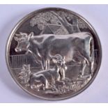 A 19TH CENTURY BRITISH DAIRY FARMERS ASSOCIATION SILVER COW BREEDER MEDALLION. 5.5 cm wide.