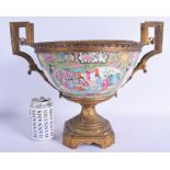 A LARGE 19TH CENTURY CHINESE CANTON FAMILLE ROSE BOWL Qing, painted with figures and landscapes, mou