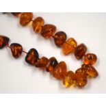 A VINTAGE AMBER TYPE NECKLACE. 54 cm long.