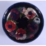 A LARGE MOORCROFT BOWL decorated with foliage. 28 cm diameter.