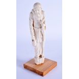 A LATE 19TH CENTURY ANGLO INDIAN CARVED IVORY BUDDHISTIC BEGGER modelled holding his staff. Ivory 16